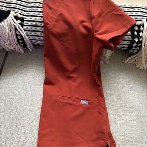 Figs rust orange scrub top